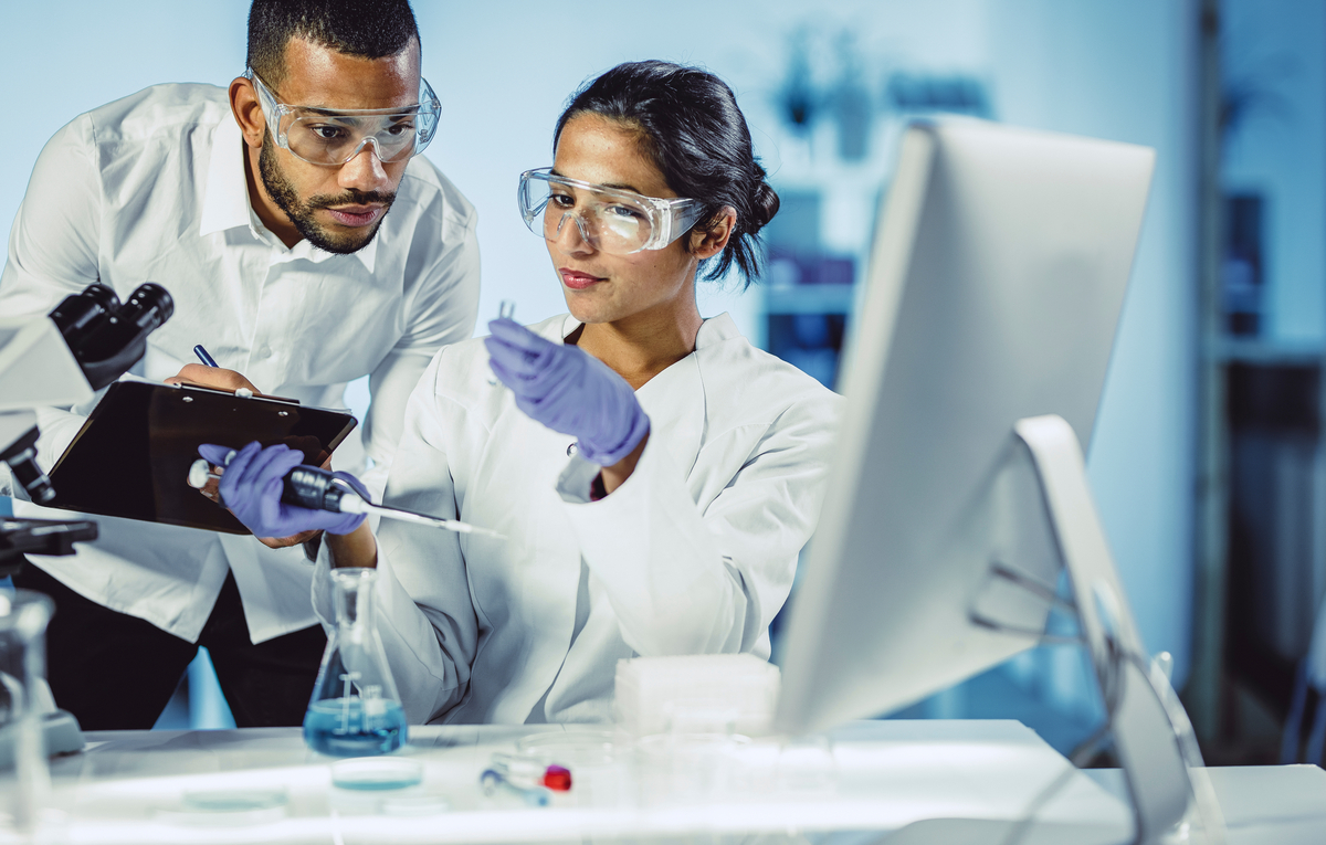 Scientists Working in The Laboratory, Using Touch Screen