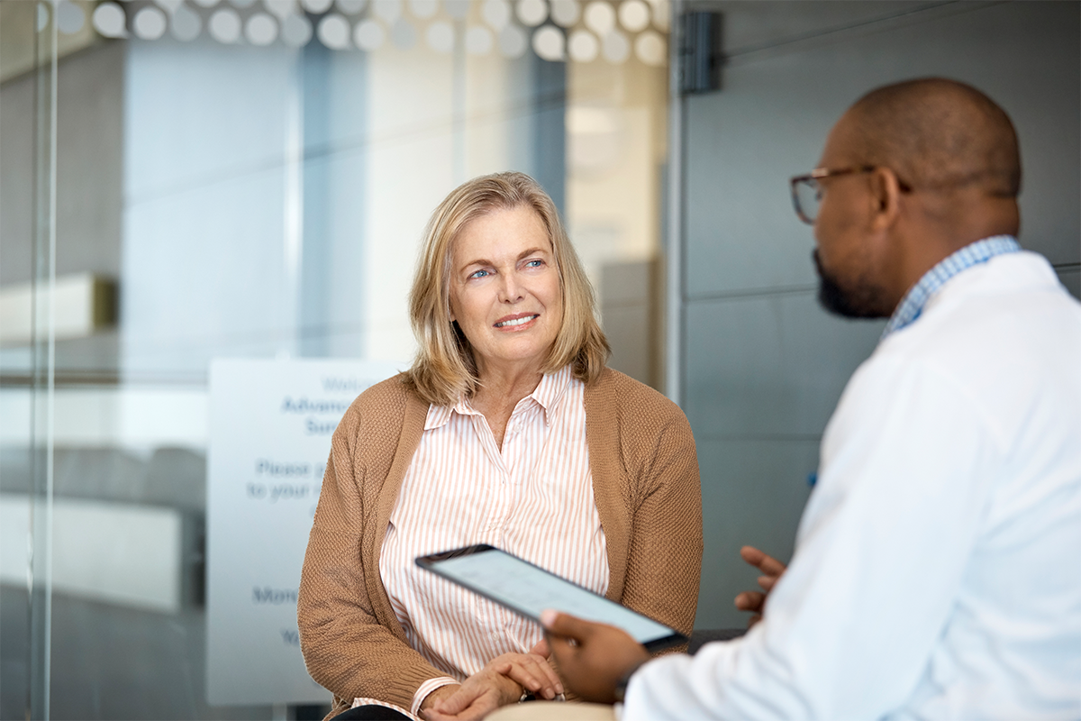 Provider sitting down with patient going over results