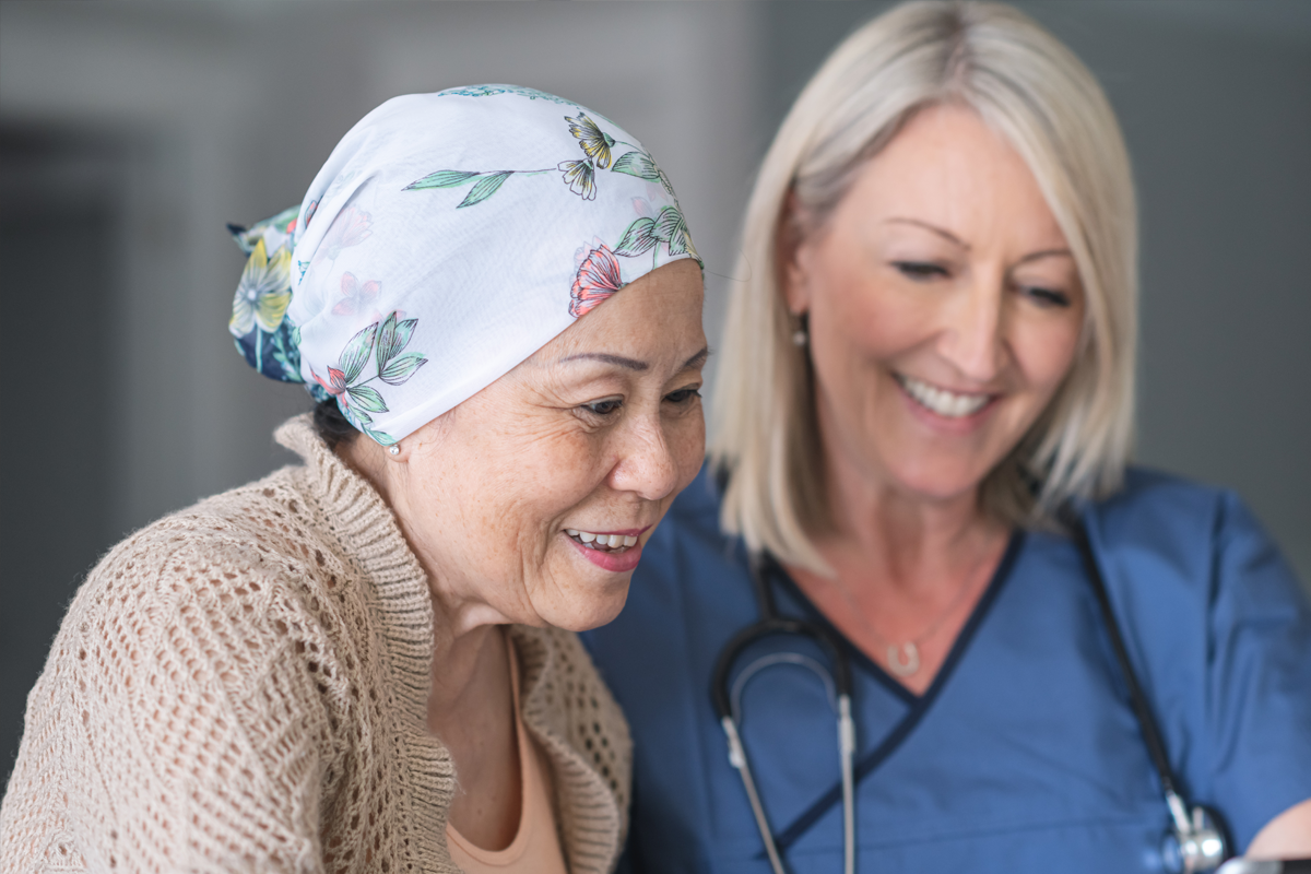 Provider and cancer patient going over personal care report