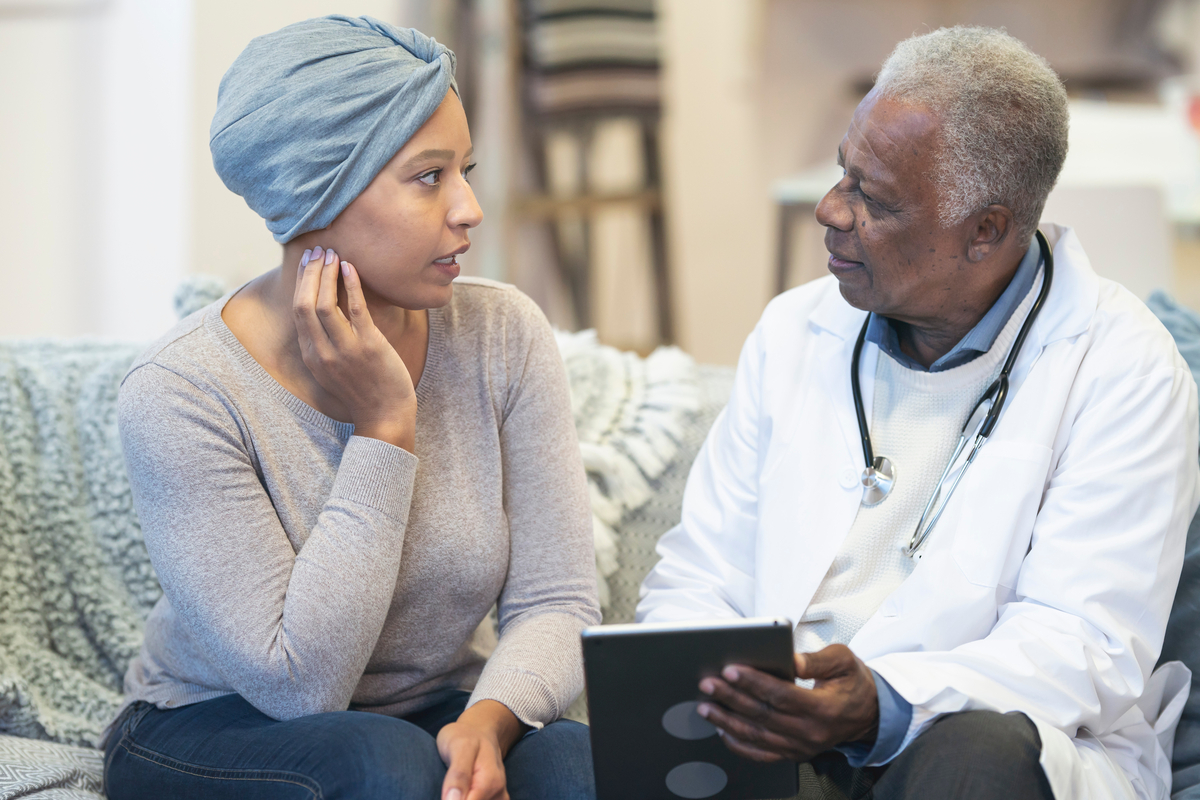 Provider talking to a cancer patient on a couch 