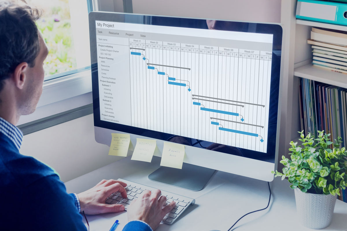 Person sitting at a desk with a scheduling application open