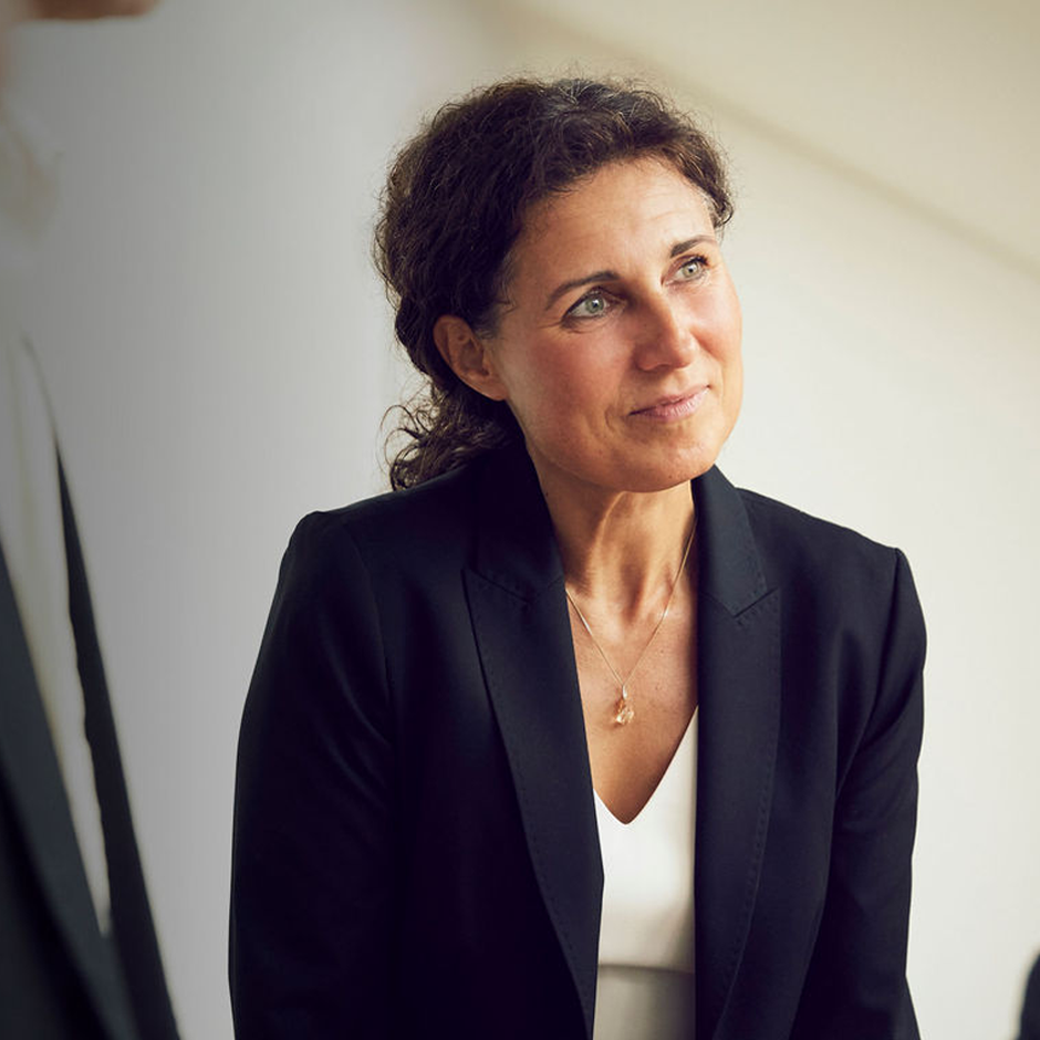 Woman listens at conference
