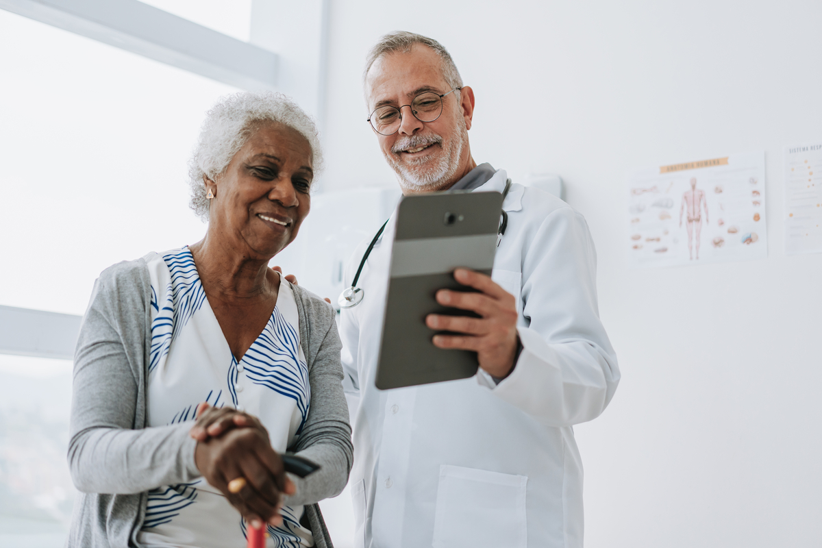 Provider showing patient results on a tablet