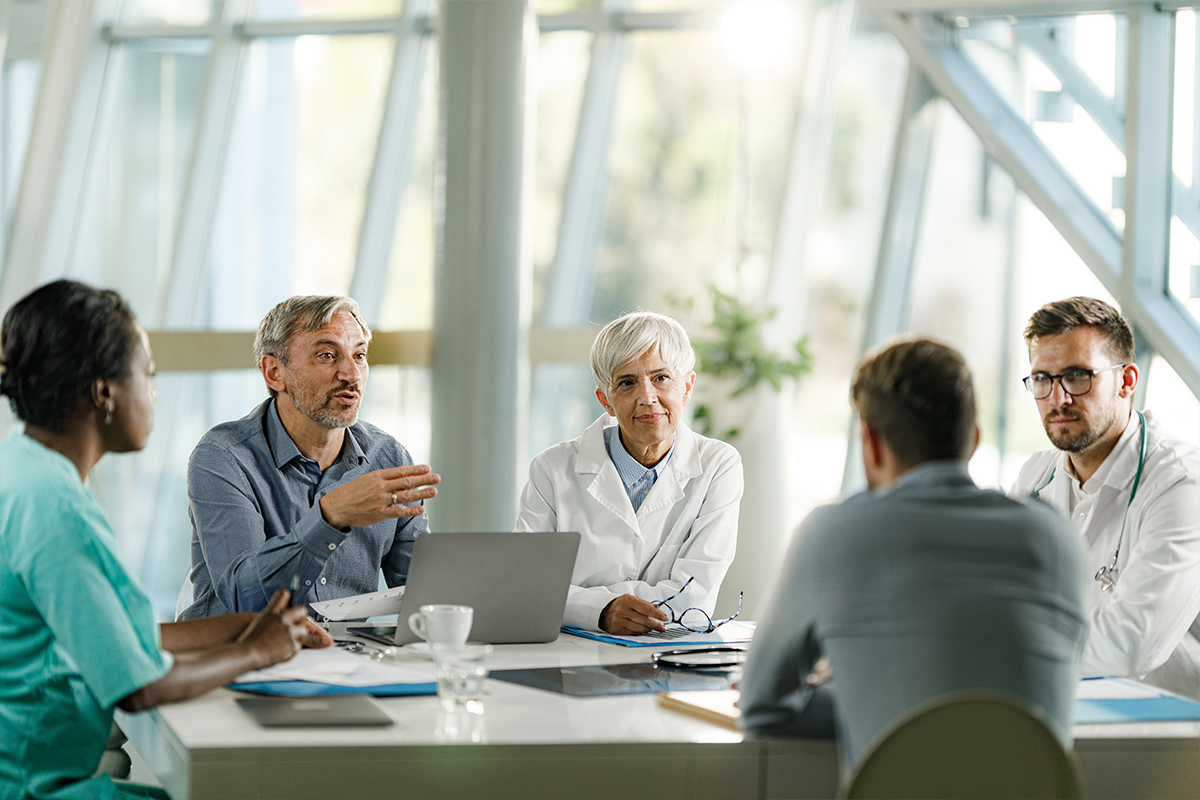 Group of medical professionals meeting in a board room